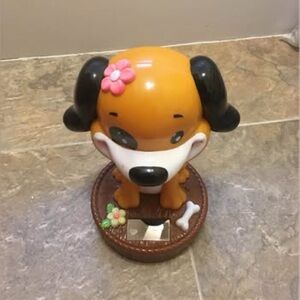 Solar power and battery operated bobble head solar dog